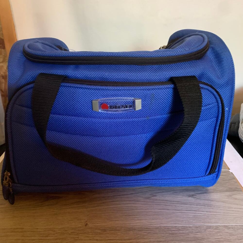 Delsey soft sided carry-on bag with detachable shoulder strap, royal blue